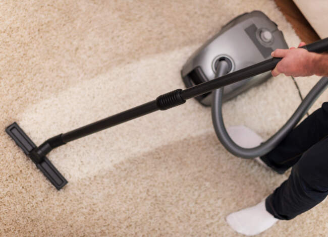 Close Up Vacuuming Carpet